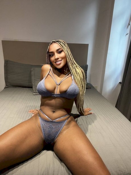 Ebony solo model Laila Santiagoo sports a nice smile during SFW action