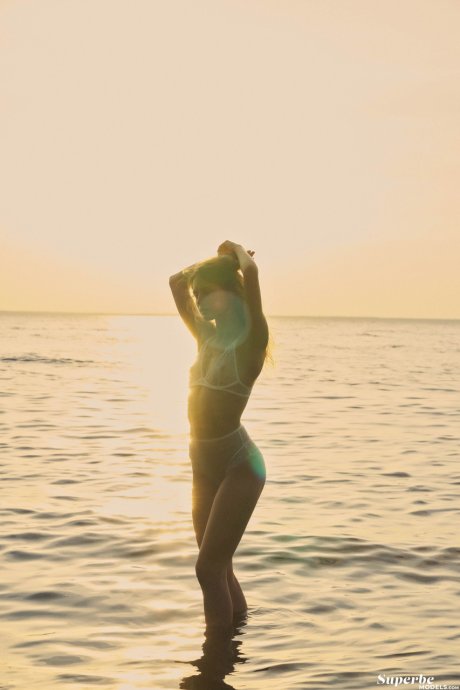 Ukrainian babe Megan Venturi stripping and posing nude in beautiful nature