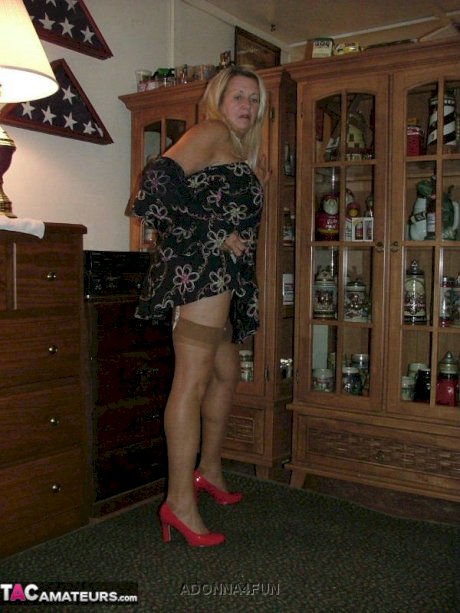 Fat grandmother with blonde hair exposes herself in tan nylons and garters