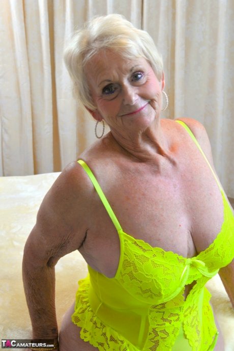 Blonde granny Sparkle looses her saggy tits from neon lingerie