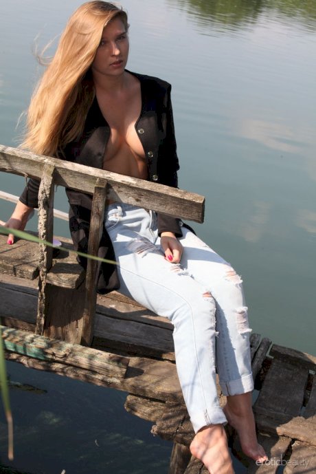 Beautiful teen Beverly A gets completely naked upon a bench on a dock