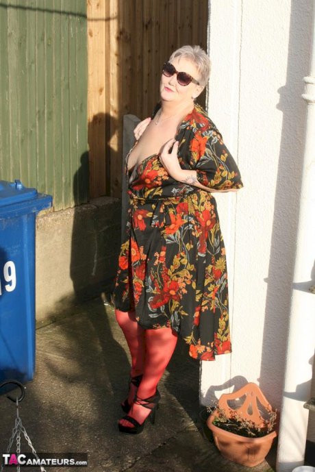 Old woman Valgasmic Exposed exposes saggy tits and big ass in yard