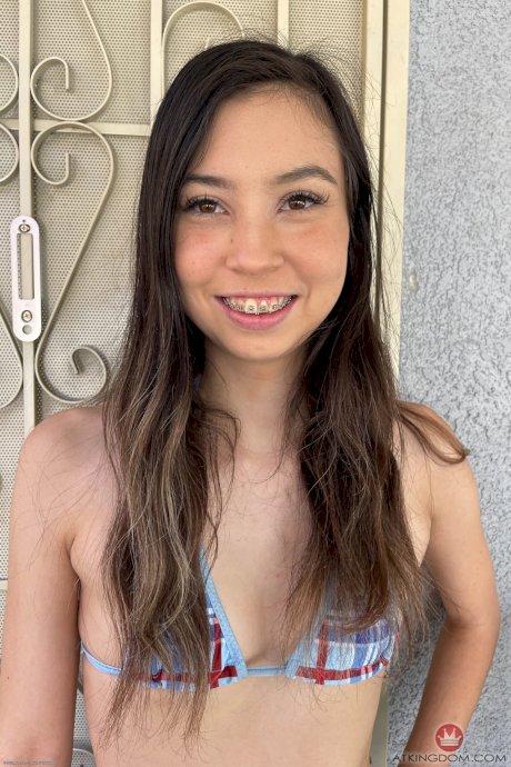 Latina girl with brunette hair Amber Angel takes off her bikini to go nude - Photo 1