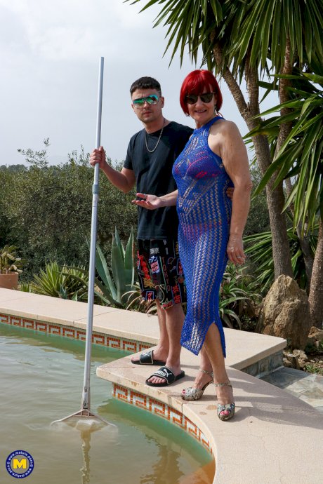Tall redheaded granny Linda gets screwed doggystyle by a young dude poolside