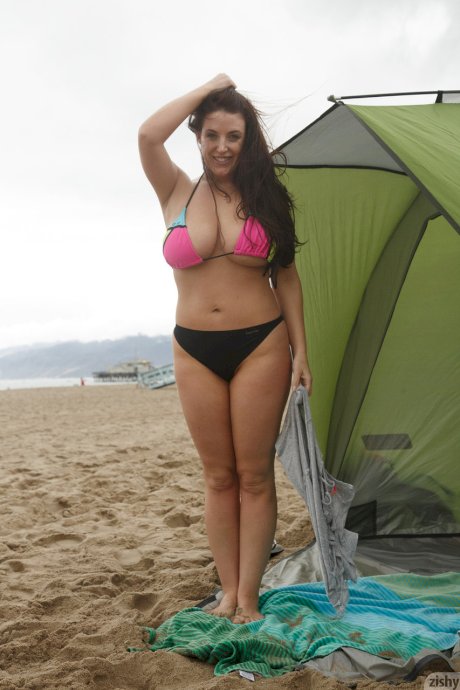 Australian stunner Angela White reveals and measures her big tits on the beach
