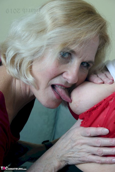 Old lesbians suck on each others boobs after modeling fully clothed