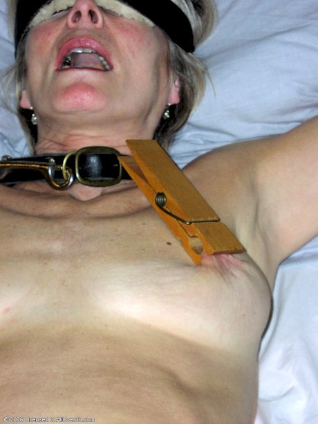 Mature Justine gets tied up and has her nips clamped before rubbing her cunt