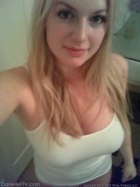 Big titted blonde amateur Danielle takes naughty selfies around the house