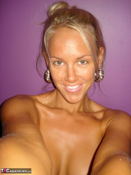 Hot blonde Aussie Jewel displays her big boobs while taking nude selfies