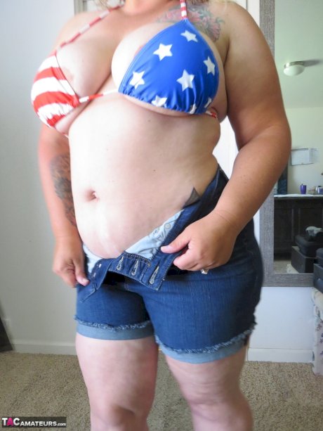 Fat amateur Busty Kris Ann licks a nipple after removing her bikini