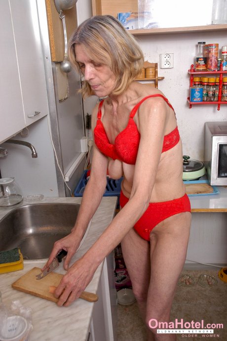 Blonde granny Helene doffs her red dress and masturbates in the kitchen