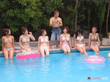 Brunette Asian women strip and enjoy hardcore group sex poolside