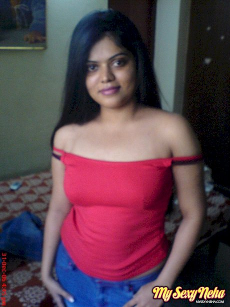Indian chick Neha uncovers her natural tits during solo action