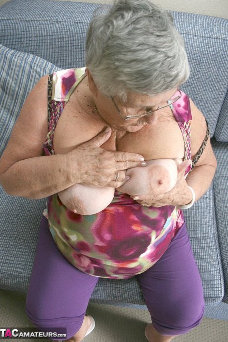 Huge fatty granny baring her saggy boobs & spreading her horny pussy wide open