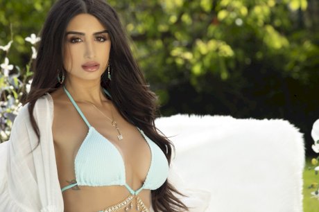 Centerfold model Mia Ventura does away with her bikini to go nude on a patio