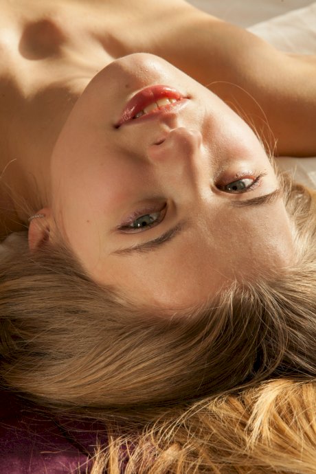 Blonde teen with a pretty face Sigrid gets completely naked atop her bed
