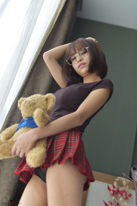 Pretty Asian teen flaunts her hot ass wearing a miniskirt and panties