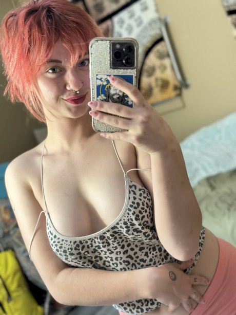 Pink-haired amateur slut Redhead Abby poses dressed up in the mirror