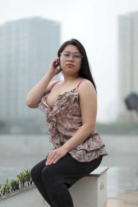 Beautiful chubby babe in glasses teases with her big boobs outdoors