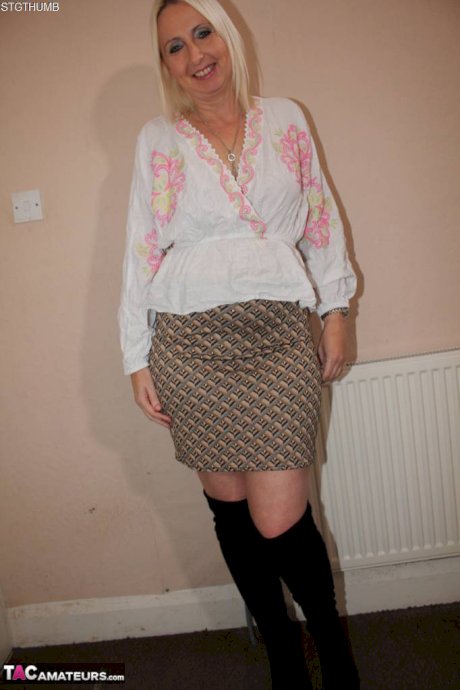 Blonde British woman Tracey Lain spreads her pussy before giving a POV blowjob