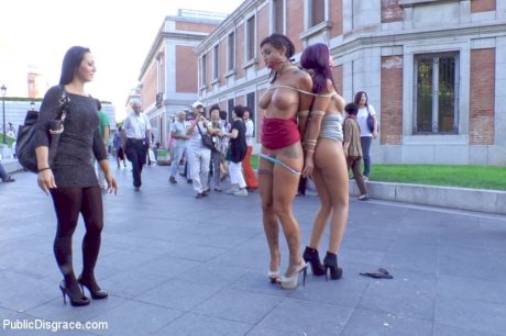 Beautiful girls are tied together during a public humiliation session - Photo 6