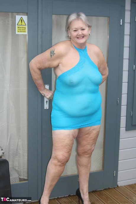 Fat granny hikes up see thru dress to expose her vagina in black pumps