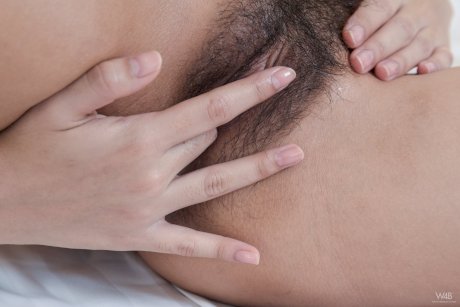 Pretty Asian babe Kahlisa flaunts her big tits and spreads her hairy pussy - Photo 18