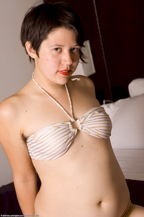 Chubby short-haired teen Carly strips & plays with her unshaven pussy