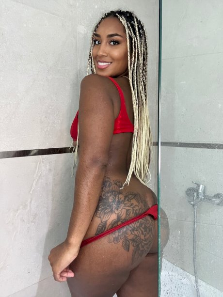 Ebony solo model Laila Santiagoo sports a nice smile during SFW action