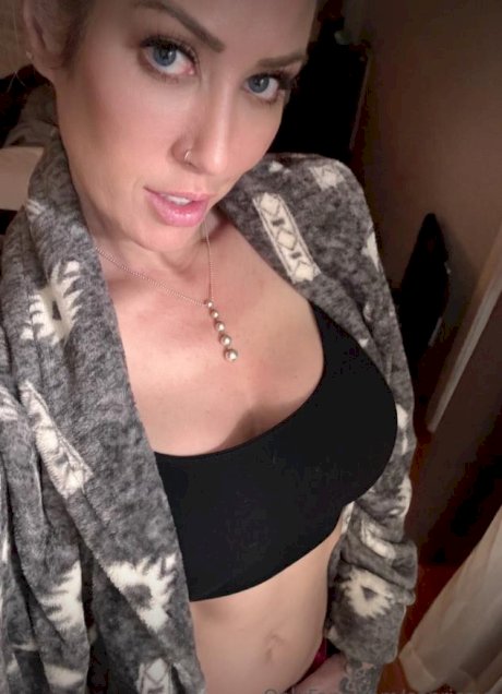 Blonde solo model Capri Cavanni takes self shots during non-nude action