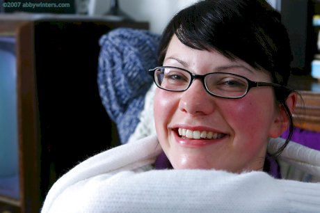 Fat chick with glasses gets undressed and flashes hairy pussy