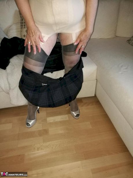 Old granny dildos her pussy in sheer nylons and garter ensemble