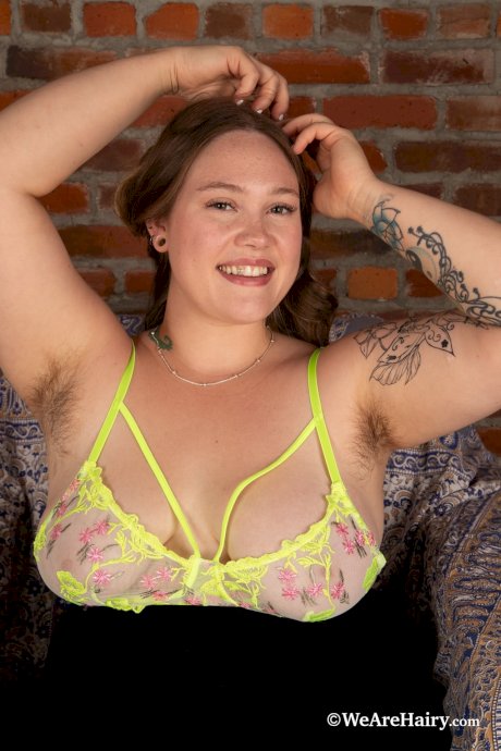 Hairy amateur fingers her trimmed twat after getting naked on a chair - Photo 6