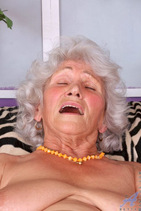 Grey haired granny Betty loses her dress and rubs her hairy vagina