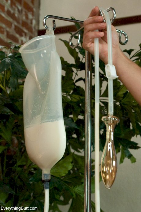 Curvaceous Beverly Hills taking a messy milk enema in a kinky BDSM scene