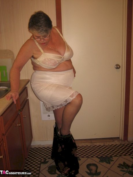 Old woman Girdle Goddess strips to pantyhose in her kitchen