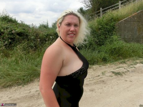 Blonde amateur Barby exposes her overweight body in a rural location