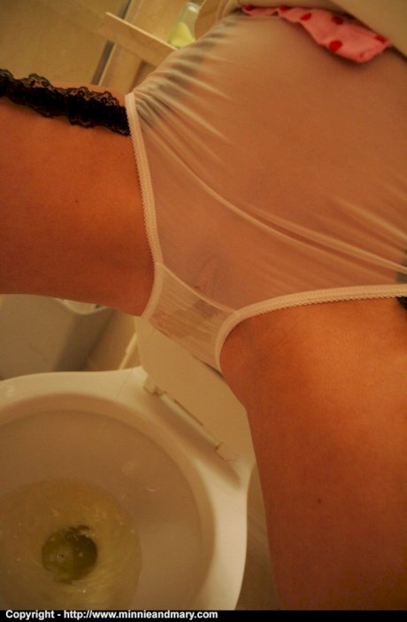 Clothed amateurs hold their pee as long as they can before taking a piss