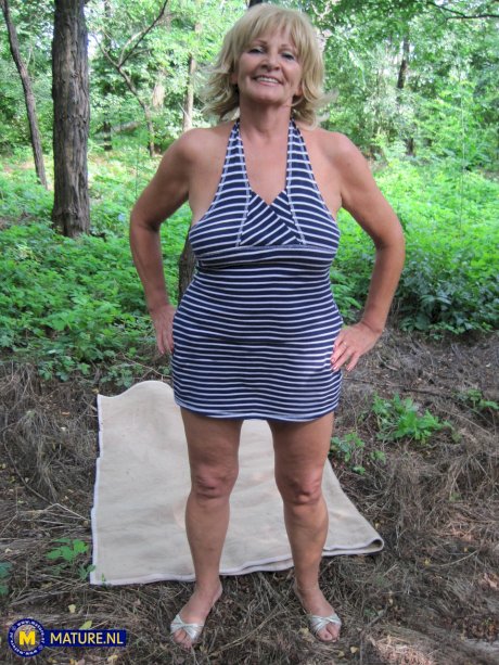 Mature blonde lady Sally G has POV sex on a blanket in the woods