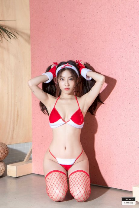 Korean model flaunts her sweet boobs and covered nips in red fishnets