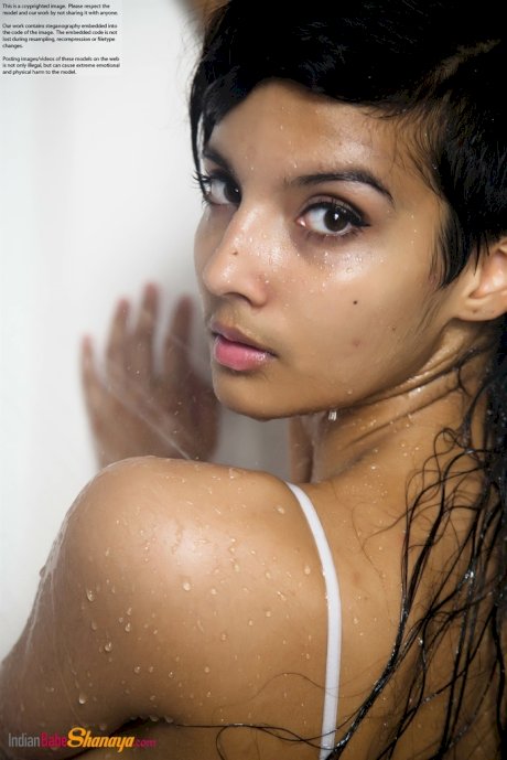 Indian solo girl takes off her wet dress to pose nude in the bathtub