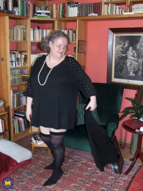 Fat mature woman Birgid strips her clothes & lingerie to show her huge body