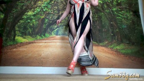 Horny MILF Samantha 38G flaunts her huge cleavage while posing in a dress