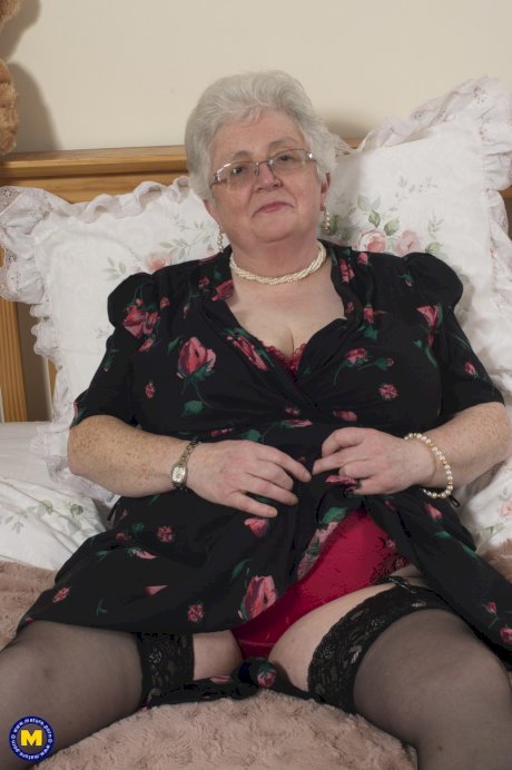 BBW granny with glasses Caroline V strips to her lingerie & masturbates