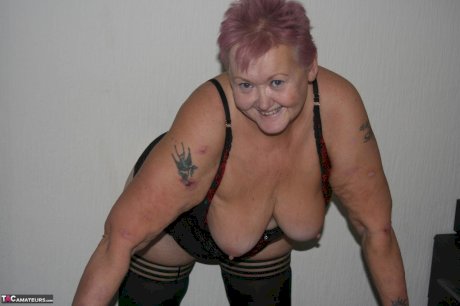 Overweight granny Valgasmic Exposed sheds her lingerie to pose nude in hosiery