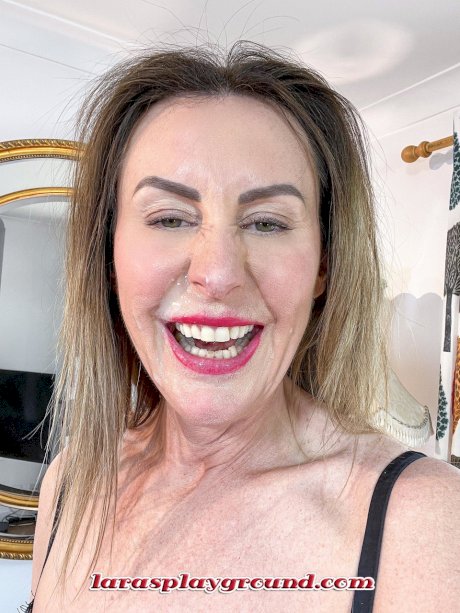 Stunning mature stewardess Lara Latex strips to her stockings & heels