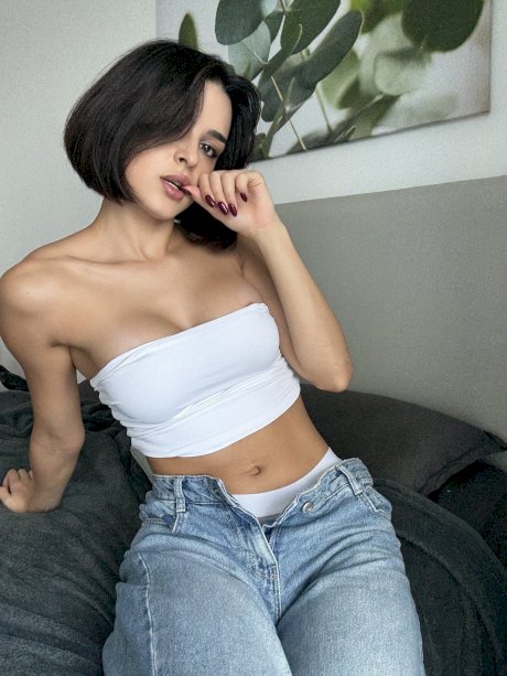 Pretty brunette Lory Dark 21 takes off her jeans in a tube top and underwear - Photo 7