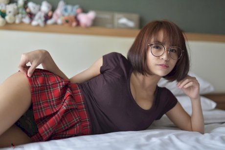 Pretty Asian teen flaunts her hot ass wearing a miniskirt and panties