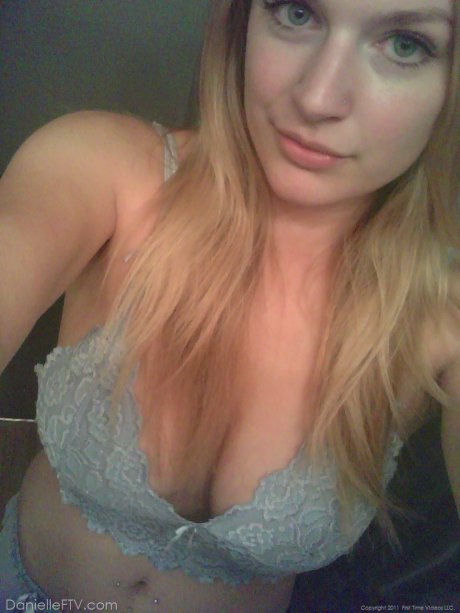 Blonde amateur Danielle takes sexy selfies around her home in a SFW manner