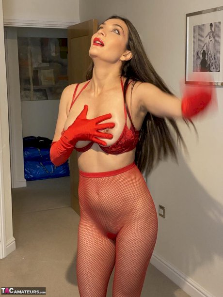 Solo girl Sexy Alinaxxx fondles her big tits while wearing red velvet gloves
